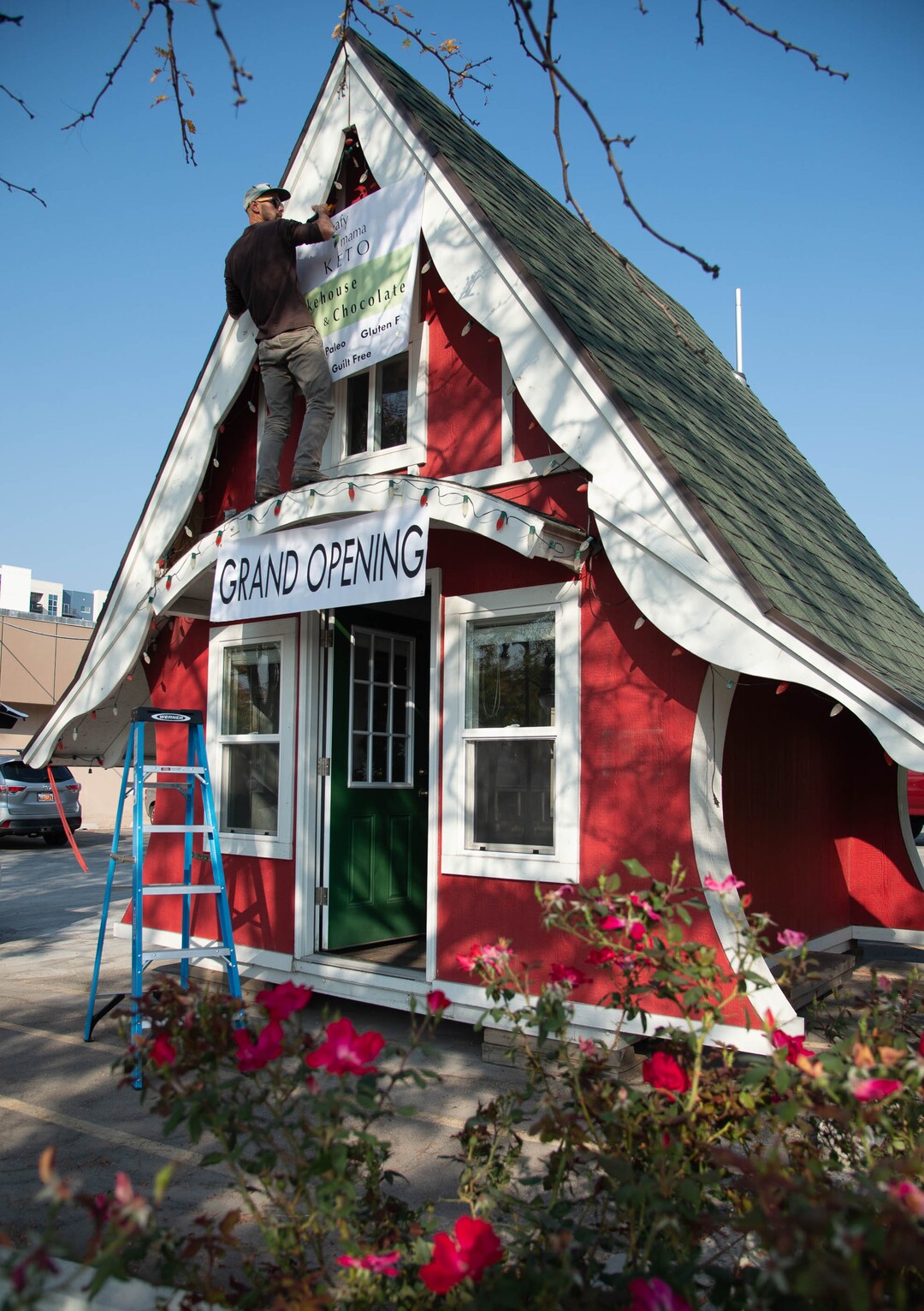 (Francisco Kjolseth  |  The Salt Lake Tribune) The iconic Sugarhouse ‘Santa Shack" is being transformed into a new gluten-free bakery called The Keto Bakehouse. Owner Melanie Edwards plans to open on Thursday, Oct. 8, selling gluten-free, low carb, no-sugar cookies, cakes, brownies, cupcakes, chocolates, trail mixes, and energy bars, as her son Cameron helps set up signage recently.