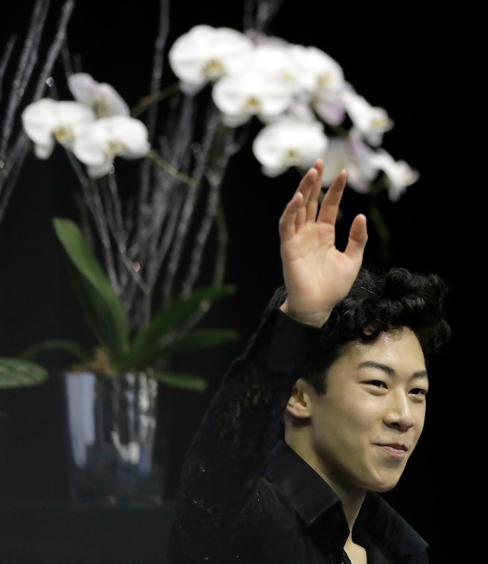 Nathan Chen waves to the crowd after his score was announced in the men's short program at the U.S. Figure Skating Championships on Friday, Jan. 20, 2017, in Kansas City, Mo. (AP Photo/Charlie Riedel)