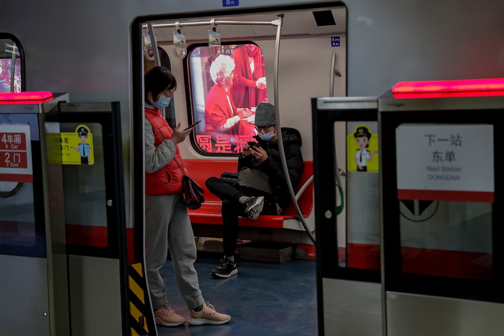 (AP Photo/Andy Wong)

Commuters wearing face masks to help curb the spread of the coronavirus browse their smartphones inside a subway train in Beijing, Feb. 10, 2021.