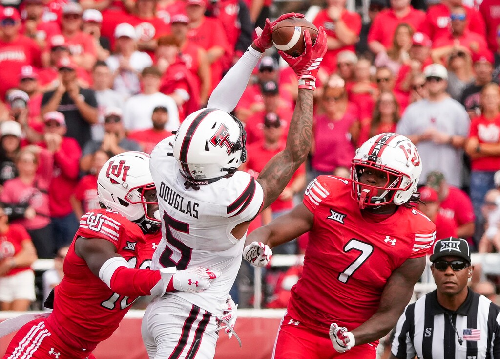 (Bethany Baker  |  The Salt Lake Tribune) Utah Utes cornerback Blake Cotton (16) and Utah Utes linebacker Johnathan Hall (7) block as Texas Tech Red Raiders wide receiver Caleb Douglas (5) reaches for a pass during the game in Salt Lake City on Saturday, Sept. 20, 2025.