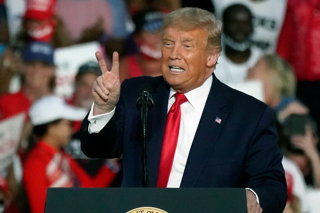 (John Raoux | AP)  President Donald Trump speaks at a campaign rally at the Orlando Sanford International Airport Monday, Oct. 12, 2020, in Sanford, Fla.