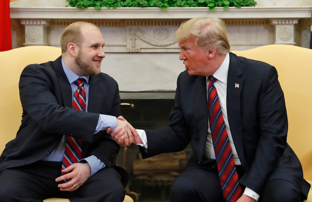 (Alex Brandon  |  AP file photo)  In this May 26, 2018, file photo President Donald Trump shakes hands with Joshua Holt, soon after his release from a prison in Venezuela, in the Oval Office of the White House.
