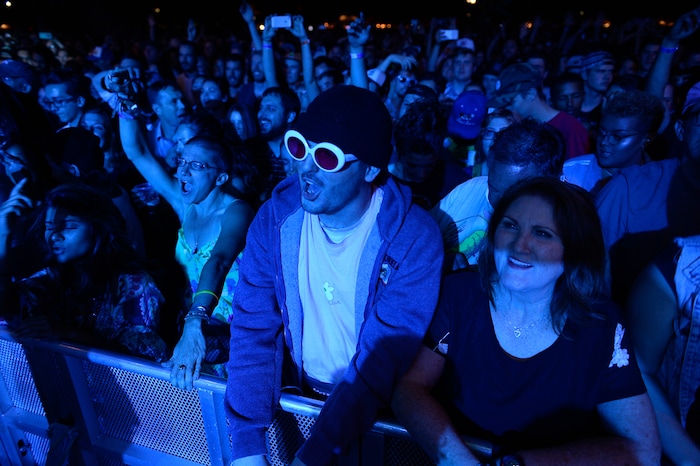 (Francisco Kjolseth | The Salt Lake Tribune) Alec Pharo, center, takes in the music as The Roots marks the finale of the 2017 SLC Twilight Concert Series at Pioneer Park on Thursday, Aug. 31, 2017.