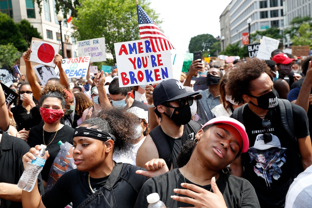 Jacquelyn Martin | The Associated Press)
TiMia White of Washington, right, dances as she protests Saturday, June 6, 2020, near the White House in Washington, over the death of George Floyd, a black man who was in police custody in Minneapolis. Floyd died after being restrained by Minneapolis police officers.
