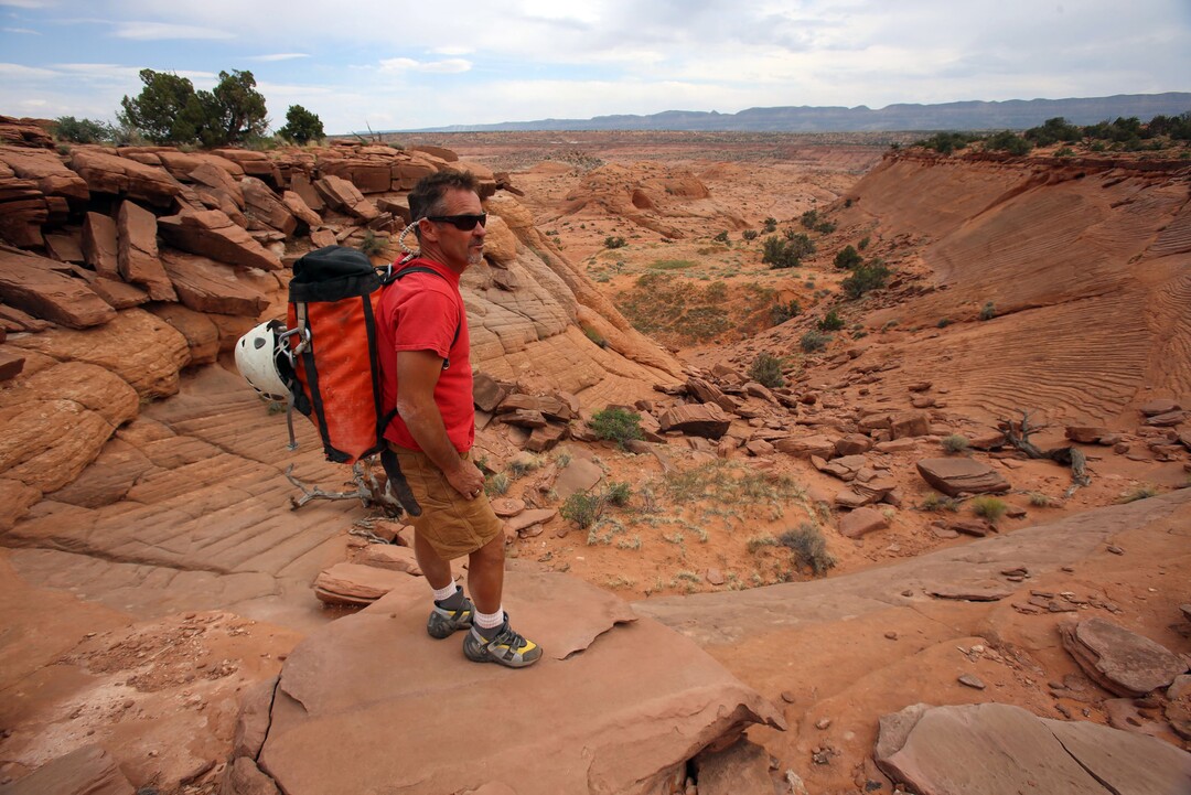 (Francisco Kjolseth  |  Tribune File Photo)  Rick Green, owner of Excursions of the Escalante surveys the landscape he calls home in the Grand Staircase-Escalante National Monument, taking customers down slot canyons and also playing a central role helping local authorities when it comes to rescuing those who get into problems in such a remote place. 