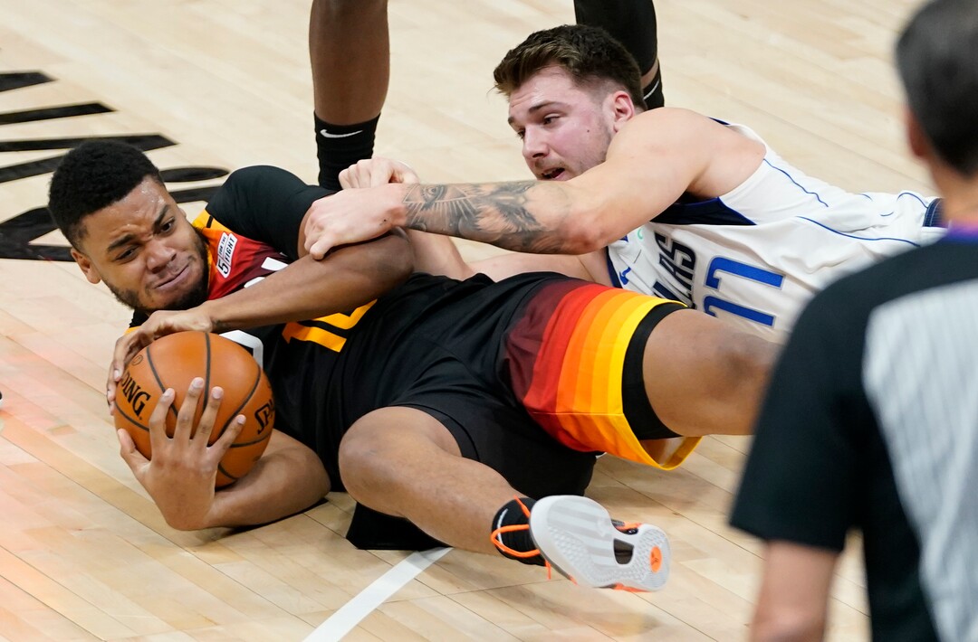 (Rick Egan | The Salt Lake Tribune)  Utah Jazz forward Juwan Morgan (16) goes for a loose ball along with Dallas Mavericks guard Luka Doncic (77), in NBA action between the Utah Jazz and the Dallas Mavericks at Vivint Arena, on Friday, Jan. 29, 2021.