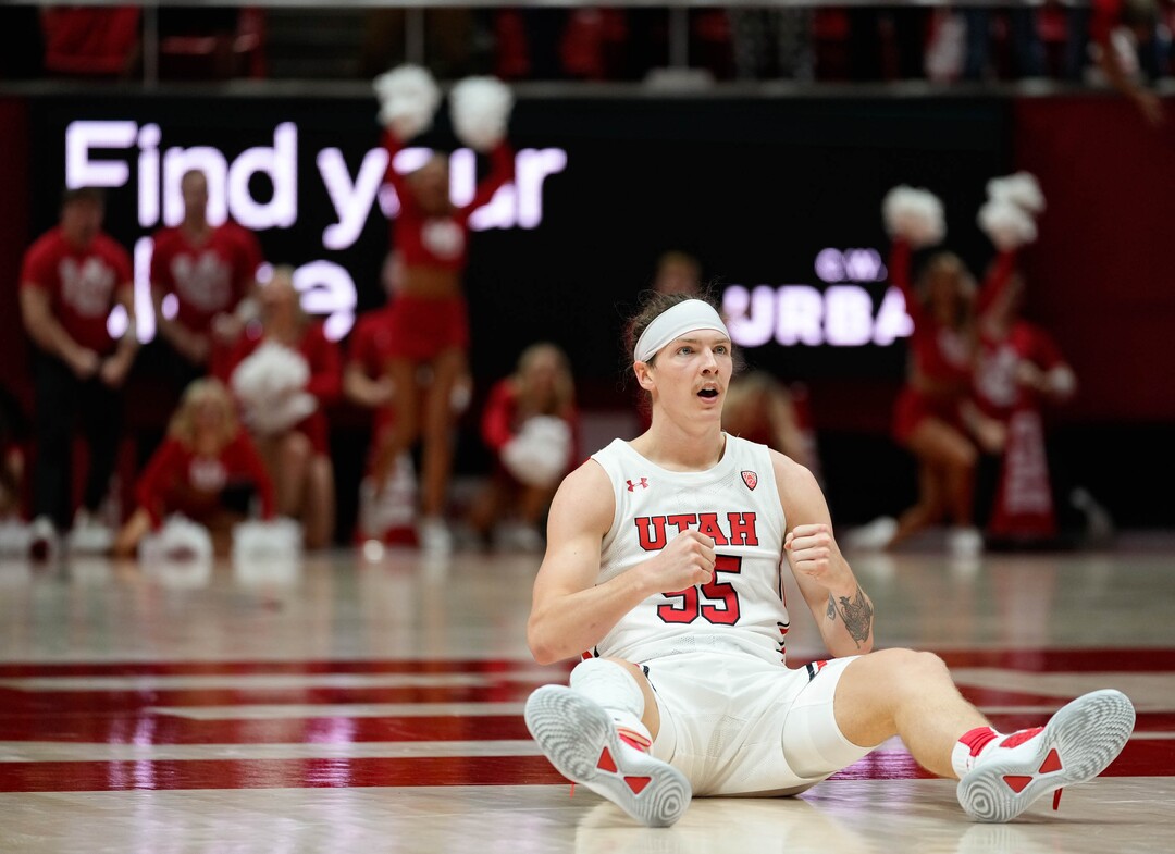 (Francisco Kjolseth | The Salt Lake Tribune) Utah Utes guard Gabe Madsen (55) watches his three pointer stay on target while drawing the fowl for an extra point as the University of Utah hosts the Arizona Wildcats in NCAA basketball in Salt Lake City on Thursday, Dec. 1, 2022.