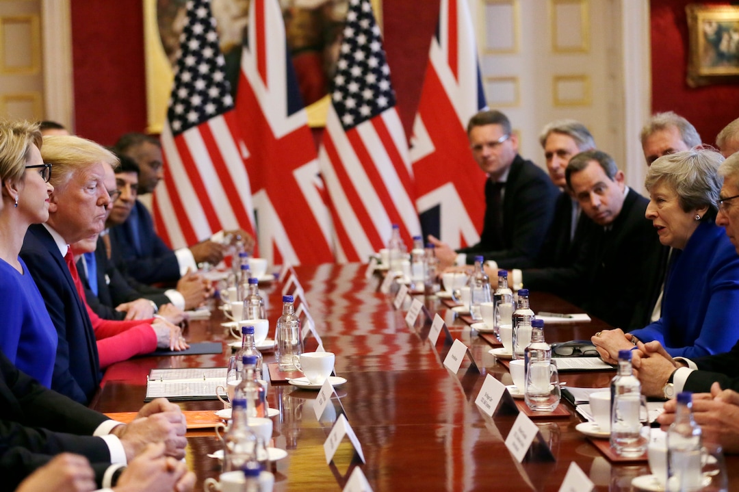 U.S President Donald Trump, center left, and British Prime Minister Theresa May, center right, attend a business roundtable event at St. James's Palace, London, Tuesday June 4, 2019. (AP Photo/Tim Ireland)