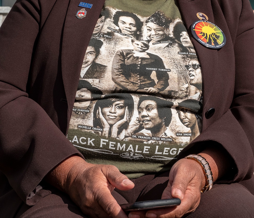 (Leah Hogsten  |  The Salt Lake Tribune) Betty Sawyer, longtime communty activist from Ogden and member of the Utah Coalition To Abolish Slavery, sports a black female legends shirt on the Capitol lawn on Tuesday. A coalition of politicians, religious leaders and civil rights activists are urged Utahns to pass Amendment C on the ballot to remove old wording in the state constitution, Sept. 22, 2020, that they say still allows slavery as a punishment for crime.