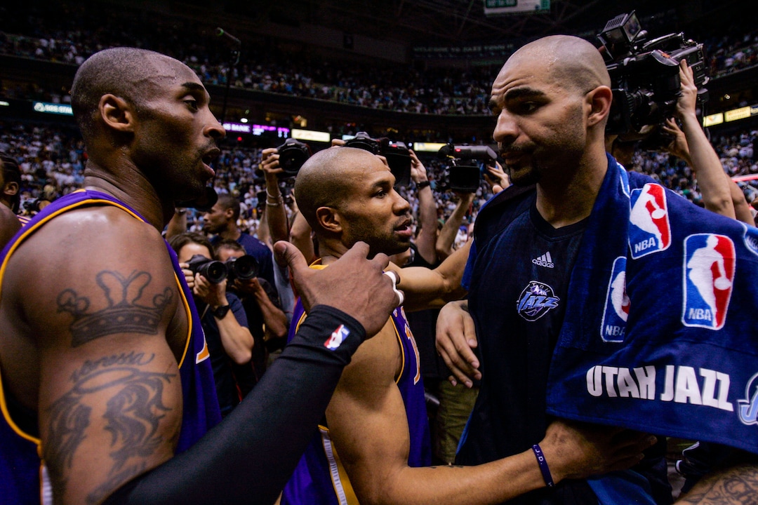 (Trent Nelson  |  The Salt Lake Tribune) Kobe Bryant and Derek Fisher with Carlos Boozer, Utah Jazz vs. Los Angeles Lakers, game six, NBA playoffs second round, Friday, May 16, 2008.