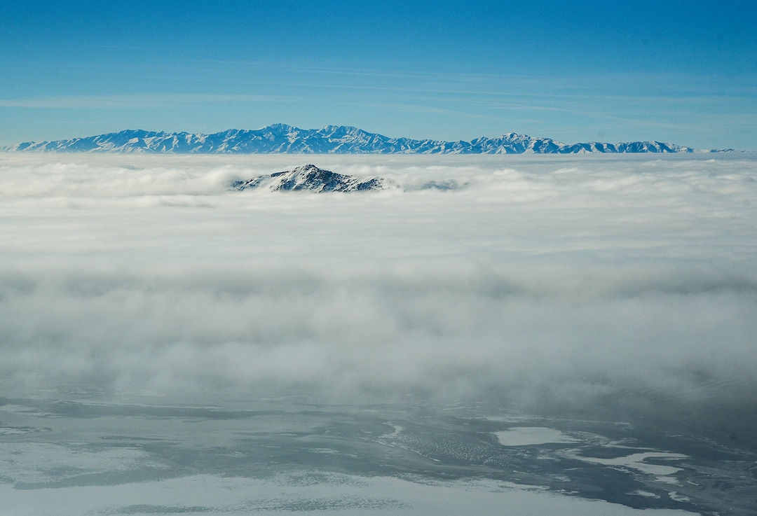(Francisco Kjolseth  |  The Salt Lake Tribune)  Antelope Island and the Oquirrh Mountains beyond poke up beyond the deteriorating air quality under inversion conditions on Monday, Jan. 14, 2019, obscuring the ground below as pilot Jeff Greenland takes every opportunity to fly above the poor conditions. Over the radio with Salt Lake Approach before landing he can be heard saying "thanks for keeping us all safe during the shutdown," as the longest government shutdown in U.S. history drags on.