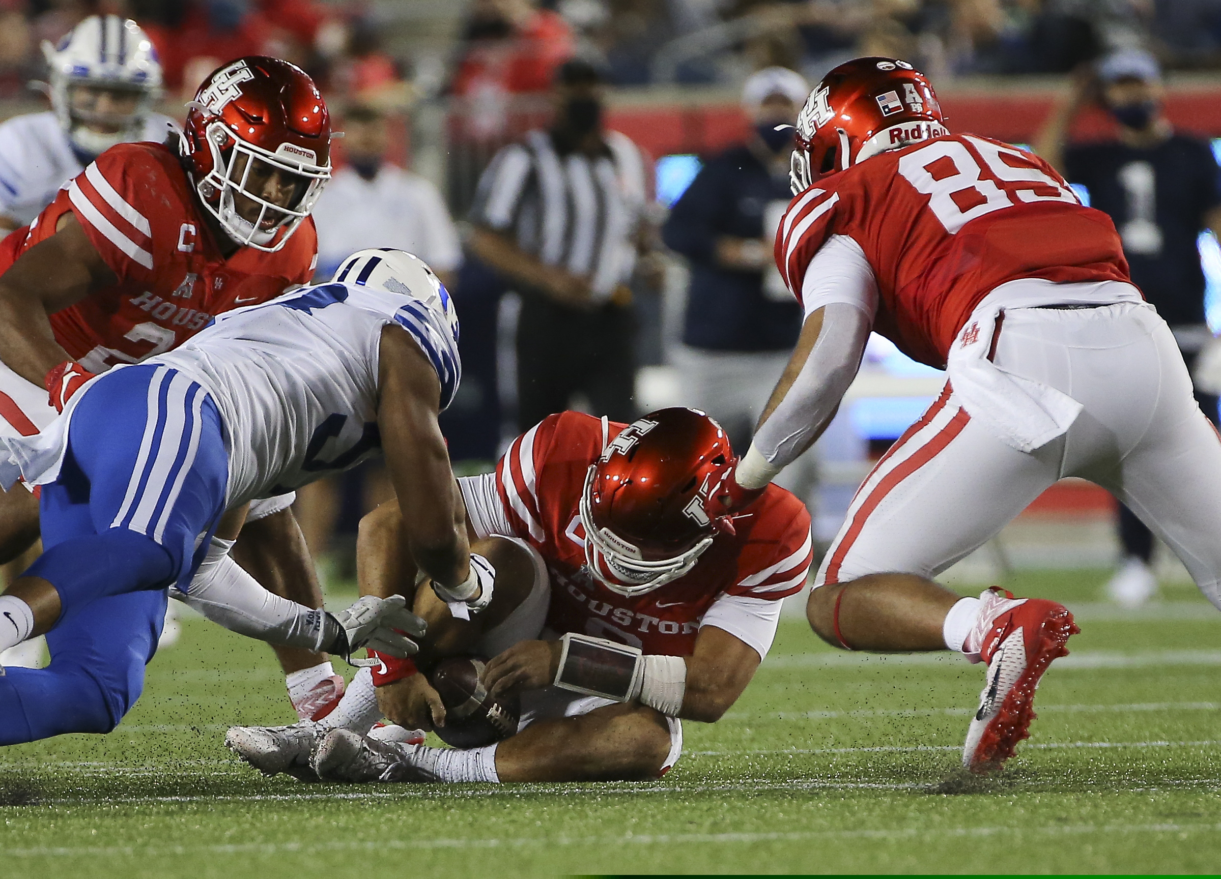 Houston quarterback Clayton Tune (3) fumbles but recovers the ball during the third quarter of an NCAA college football game against BYU Friday, Oct. 16, 2020, in Houston. (Yi-Chin Lee/Houston Chronicle via AP)