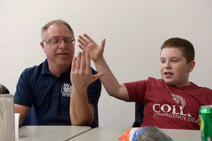 (Scott Sommerdorf | The Salt Lake Tribune)
Real Salt Lake Academy math teacher Steve Mond gets a high five from his son Nathan, 14, during the watch party at the school, Friday, May 11, 2018, as they showed his performance in the JEOPARDY! Teachers Tournament.