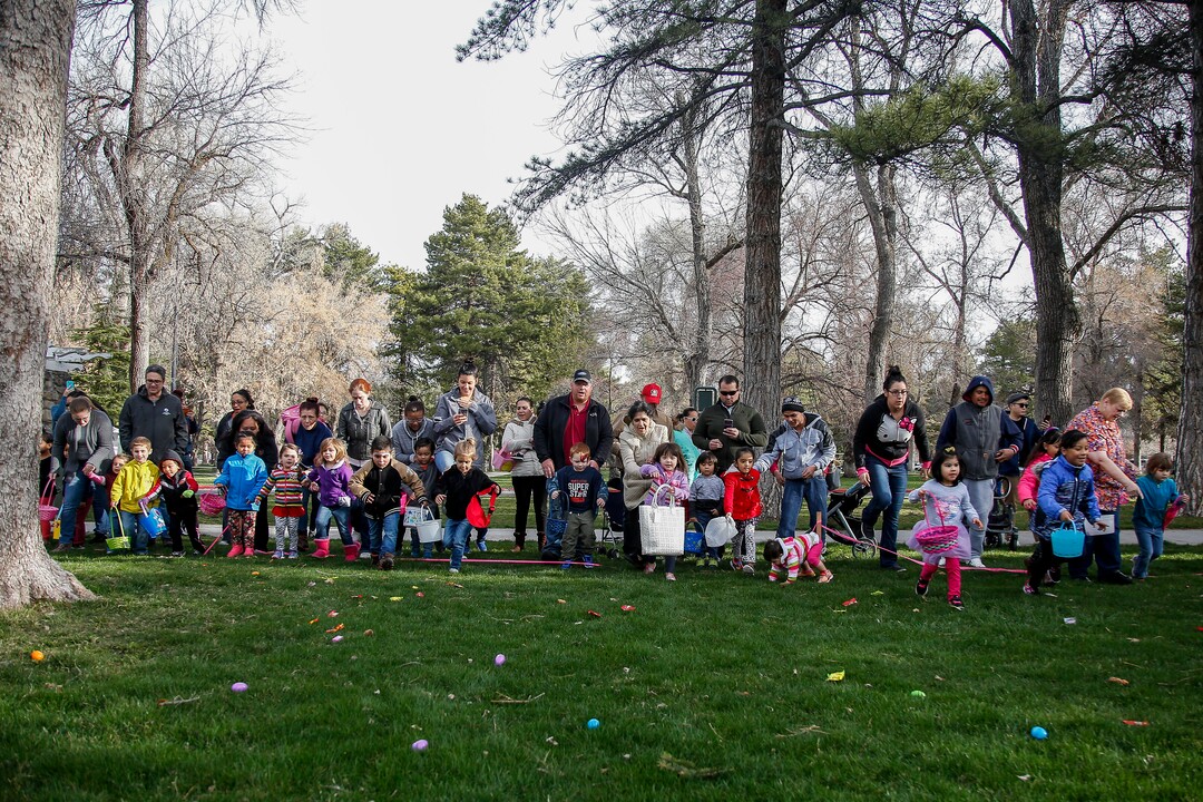 (Nicole Boliaux  |  For The Tribune)  Children and their families run to grab Easter eggs during the annual Easter egg hunt put on by A Kid's Place Dentistry in Liberty Park in Salt Lake City on Saturday, March 31, 2018.