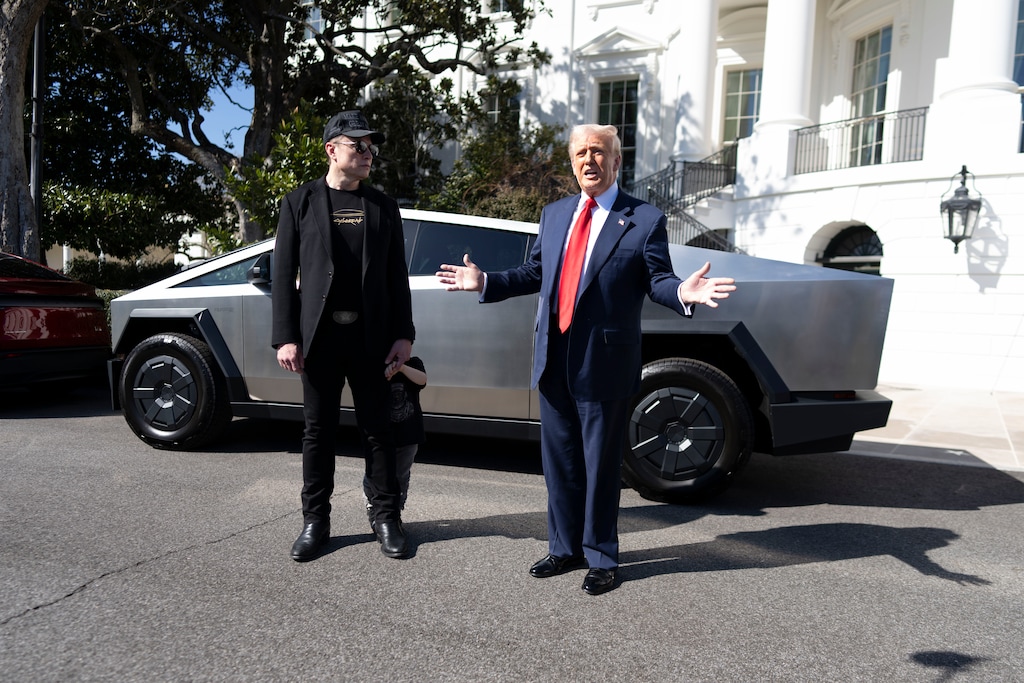 (Doug Mills | The New York Times) President Donald Trump and Elon Musk, standing with his son X AE A-Xii, look at Tesla vehicles on the South Grounds of the White House in Washington, on Tuesday, March 11, 2025.