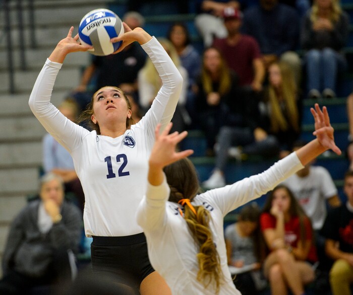 (Steve Griffin | The Salt Lake Tribune) Taela Laufiso sets the ball against Copper Hills during volleyball match at Copper Hills High School in West Jordan Tuesday September 26, 2017.