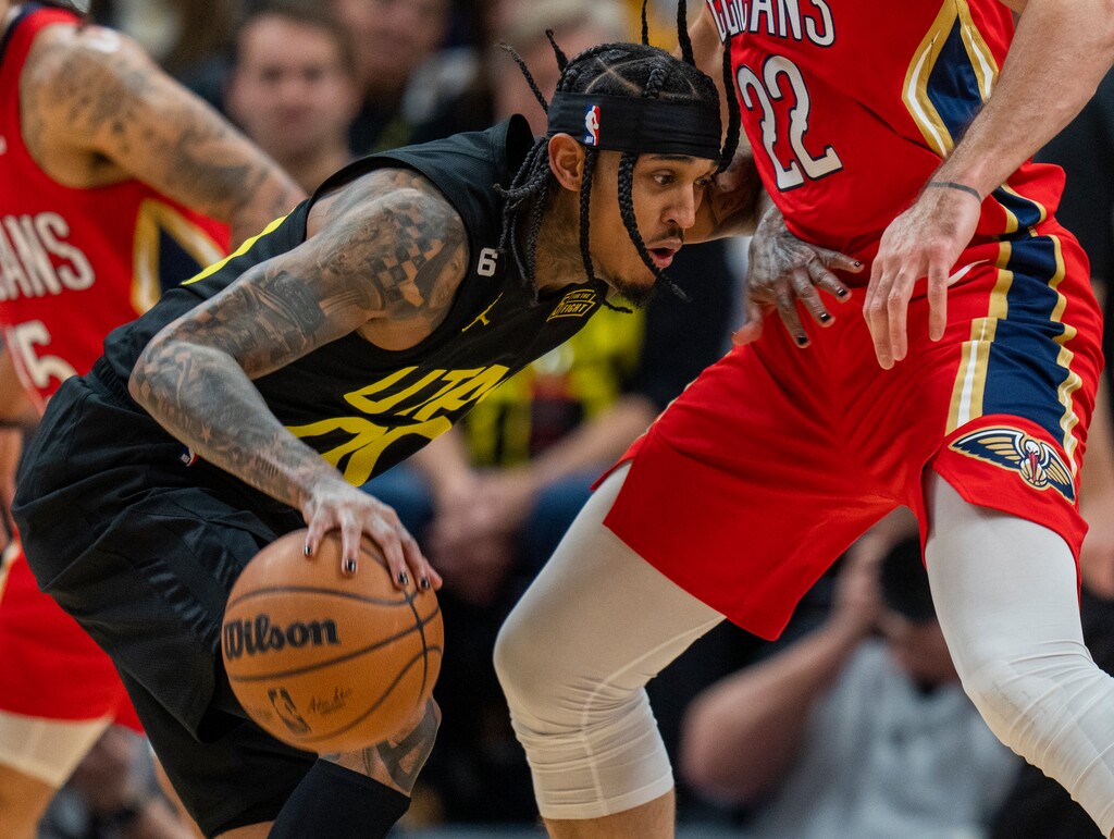 (Rick Egan | The Salt Lake Tribune) Utah Jazz guard Jordan Clarkson (00) tries to get past New Orleans Pelicans forward Larry Nance Jr. (22), in NBA action between the Utah Jazz and the New Orleans Pelicans, at Vivint Arena, on Tuesday, Dec. 13, 2022.
