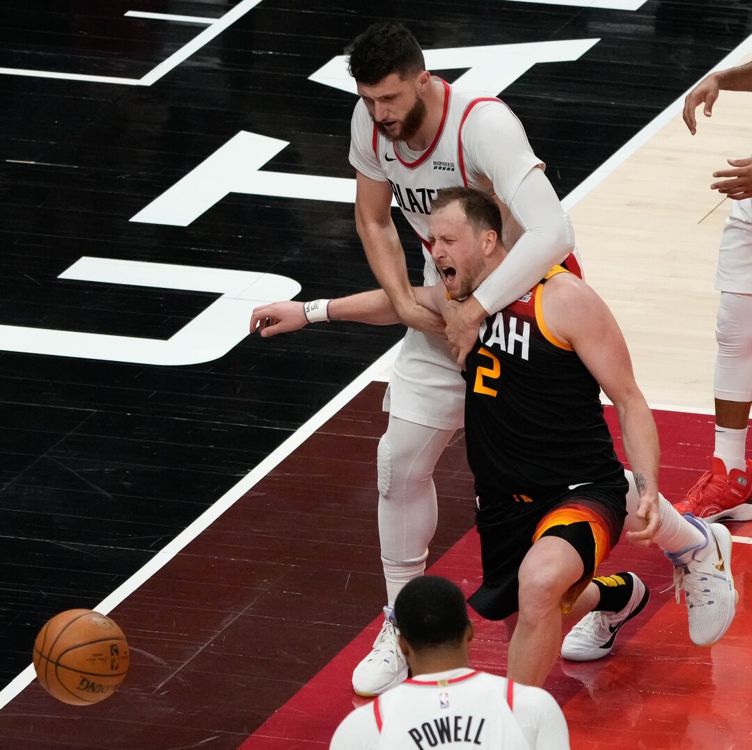 (Francisco Kjolseth | The Salt Lake Tribune) Utah Jazz guard Joe Ingles (2) is pulled down by Portland Trail Blazers center Jusuf Nurkic (27) in NBA action between the Utah Jazz and the Portland Trail Blazers, at Vivint Smart Home Arena, on Wednesday, May 12, 2021.