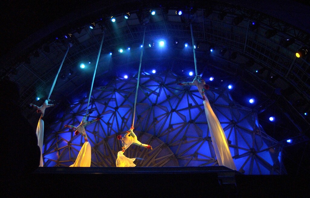 Steve Griffin | The Salt Lake Tribune
Acrobats slide down long pieces of material onto the stage at the Olympic Medals Plaza during kicking off the first night of activities in downtown Salt Lake City Feb. 9, 2002. The first medalists of the 2002 Olympics received their medals and the Dave Mathews Band performed.