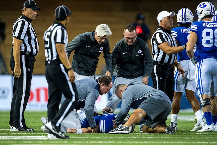 (Chris Detrick  |  The Salt Lake Tribune)  Brigham Young Cougars quarterback Beau Hoge (7) remains on the ground after being tackled during the game at Merlin Olsen Field at Maverik Stadium Friday, September 29, 2017.