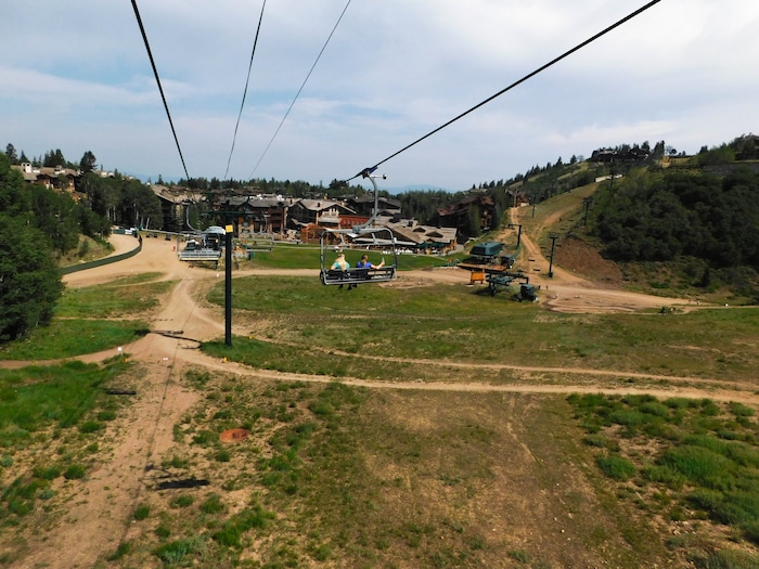 (Erin Alberty|The Salt Lake Tribune) A ski lift rises out of Silver Lake Village on Aug. 6, 2017 at Deer Valley Resort.
