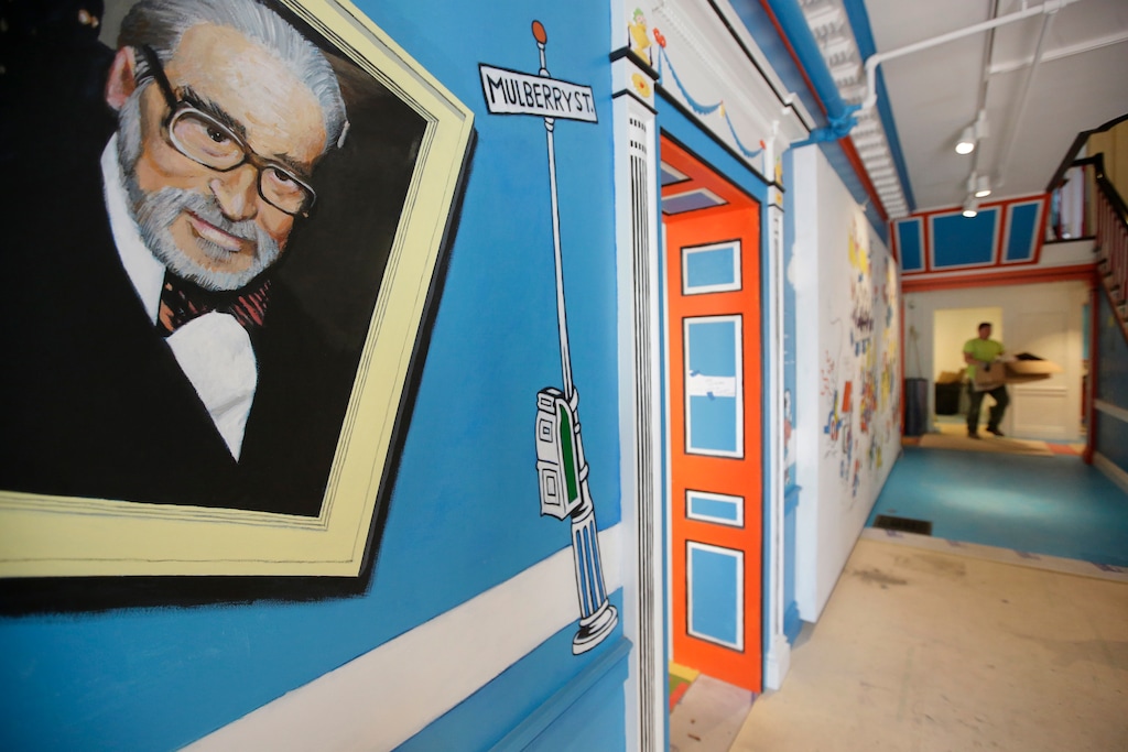 (Steven Senne | AP photo)

In this May 4, 2017, photo a mural that features Theodor Seuss Geisel, left, also know by his pen name Dr. Seuss, rests on a wall near an entrance at The Amazing World of Dr. Seuss Museum, in Springfield, Mass.