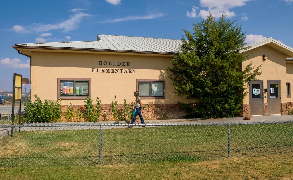 (Leah Hogsten | The Salt Lake Tribune) Boulder Elementary teacher Elizabeth Julian and kindergarten student Wiley Williams, August 27, 2020. "I'm trying to make it as safe as possible," said Julian, who got creative for the 2020 school year amid the coronavirus and acquired a giant wedding tent and a church pavilion to teach in and under. "Let's get six weeks in and see how it goes." The 29 students in the K-6th grade school are separated into two groups - primary K-2nd graders and intermediate 3rd-6th graders.
