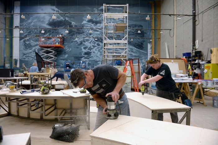 (Al Hartmann  |  The Salt Lake Tribune) 	Carpenters Tony Johnson, center,  and Stephanie Ball work on stage construction in early December for Utah Opera's new production of "Moby-Dick," which will play in January 2018. 
