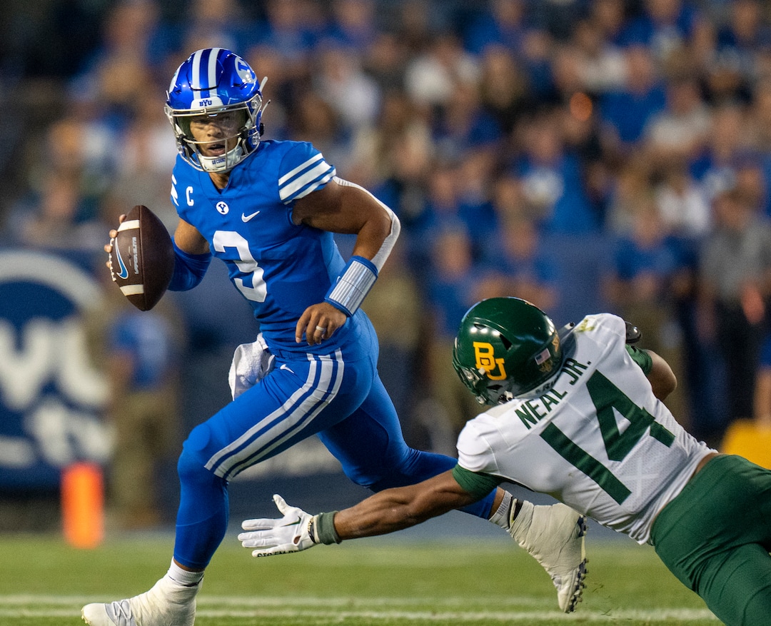 (Rick Egan | The Salt Lake Tribune) Brigham Young Cougars quarterback Jaren Hall (3) scrambles with the ball, as  Baylor Bears safety Devin Neal (14) defends, in football action between the Brigham Young Cougars and the Baylor Bears at LaVell Edwards Stadium in Provo, on Saturday, Sept. 10, 2022.
