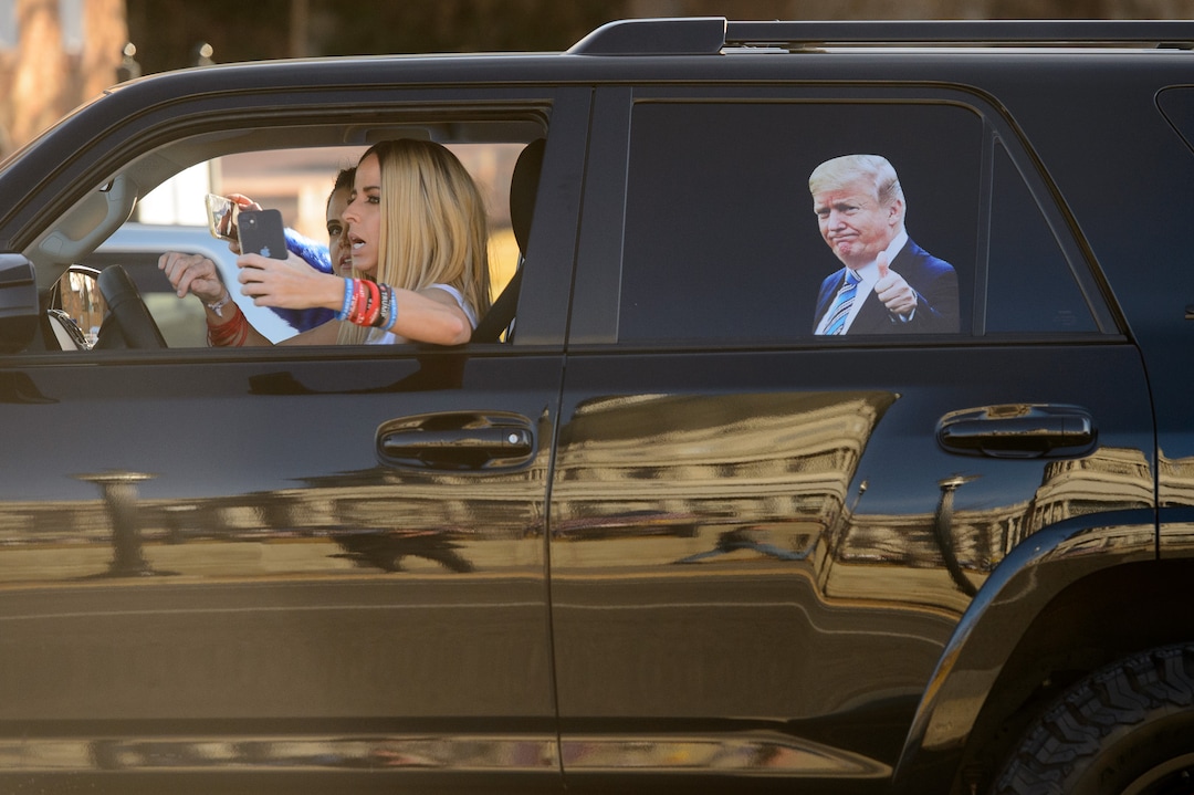(Trent Nelson  |  The Salt Lake Tribune) A passing car as Trump supporters gathered at the State Capitol in Salt Lake City on Wednesday, Jan. 6, 2021.