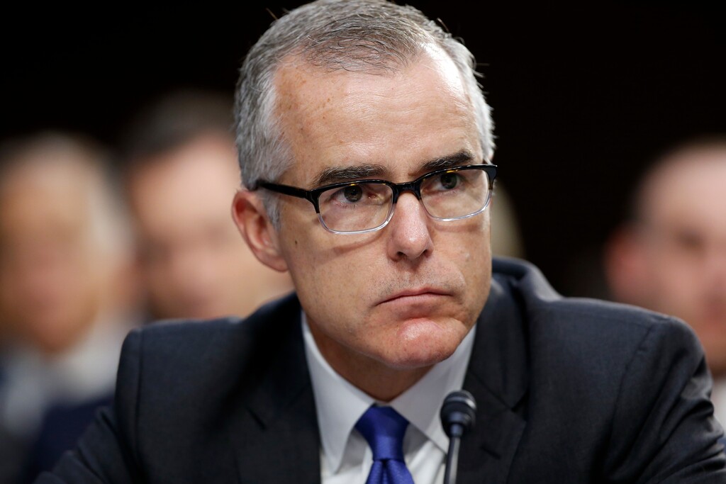 FILE - In this June 7, 2017, file photo, then-FBI acting director Andrew McCabe listens during a Senate Intelligence Committee hearing about the Foreign Intelligence Surveillance Act, on Capitol Hill in Washington. McCabe is making his case at the Justice Department for why he should not be fired. McCabe was inside the Justice Department building March 15, 2018. A person familiar with the matter but not authorized to speak publicly about it said McCabe was pleading his case against termination. Disciplinary officials at the FBI have recommended that the Justice Department fire McCabe ahead of his scheduled retirement Sunday.(AP Photo/Alex Brandon, File)