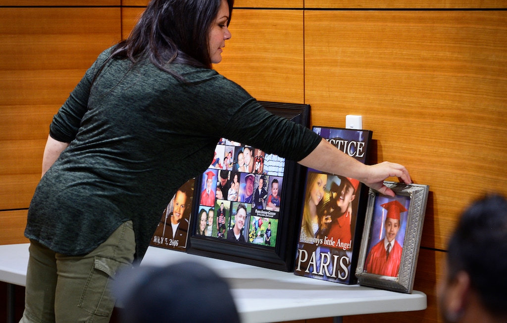 Scott Sommerdorf | The Salt Lake Tribune
Paris Gustin's Aunt, Shante McArthur places photos of Paris Gustin before a 2016 press conference asking for anyone with information about the shooting that took Paris' life to come forward and assist the investigation. The man charged with killing the teenager has been extradited from Mexico.