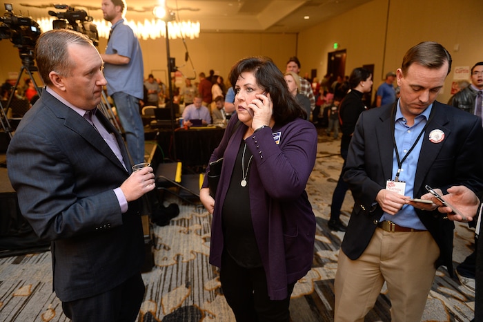(Francisco Kjolseth  |  The Salt Lake Tribune)  State Auditor John Dougall, Provo mayoral candidate Sherrie Hall Everett and Rep. Mike Winder, R- West Valley, from left, check on election results at the Provo Marriott Hotel & Conference Center Tuesday, Nov. 7, 2017.