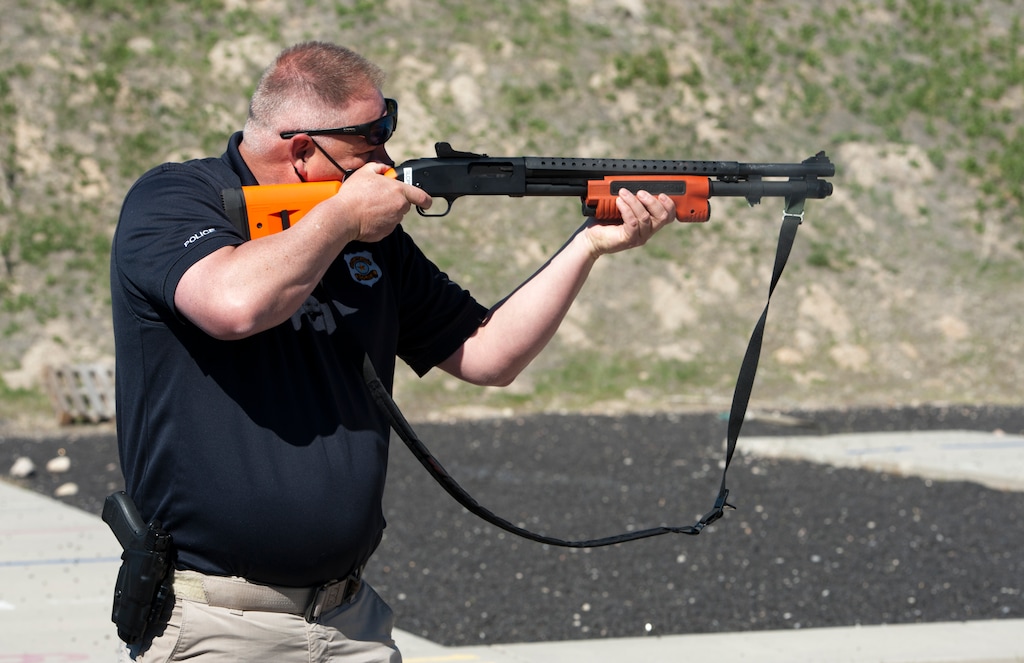 (Ed Kosmicki | Special to The Tribune) Salt Lake City Police Det. Greg Wilking fires a specially-outfitted soft bag shotgun at a paper target at the Salt Lake City Police training range Monday, April 12, 2021.