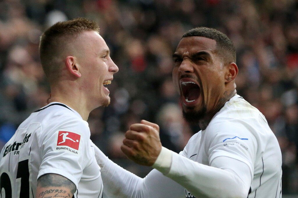 Frankfurt's  Marius Wolf, left, and Kevin-Prince Boateng celebrate a goal during the German Bundesliga soccer match between Eintracht Frankfurt and 1. FC Cologne in Frankfurt, Germany, Saturday, Feb. 10, 2018. (Thomas Frey/dpa via AP)