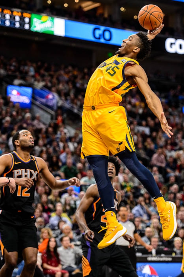 (Trent Nelson | The Salt Lake Tribune)  Utah Jazz guard Donovan Mitchell (45) grabs a rebound as the Utah Jazz host the Phoenix Suns, NBA basketball in Salt Lake City, Wednesday Feb. 14, 2018.
