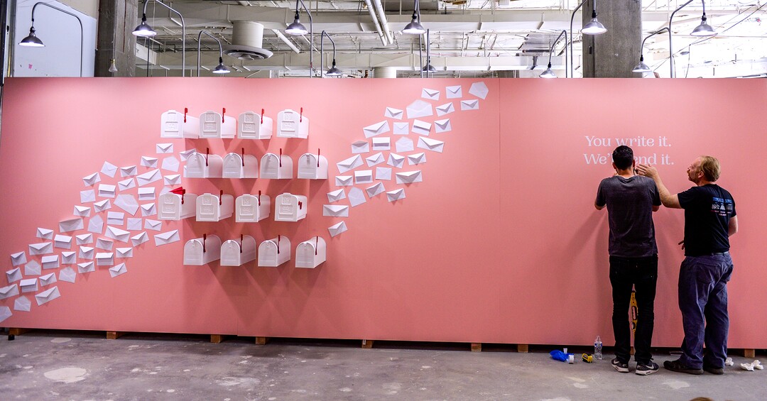 (Leah Hogsten  |  The Salt Lake Tribune) l-r Love Letters Museum co-designer Josh Clason and friend Dustin Romero put the finishing touches on an installation that encourages people to write and address postcards that   the Love Letters Museum will add postage and mail. The show opens June 21, 2109. Love Letters is the newest 15,000-square-foot interactive art installation at The Gateway dedicated to the love of letters, as well as typography, books and literal love letters. “It is our attempt to use what we know best (letters, words, and art) to encourage each of our visitors to find and tell their own story. And to find the art in other's stories” -Love Letters Museum. ​