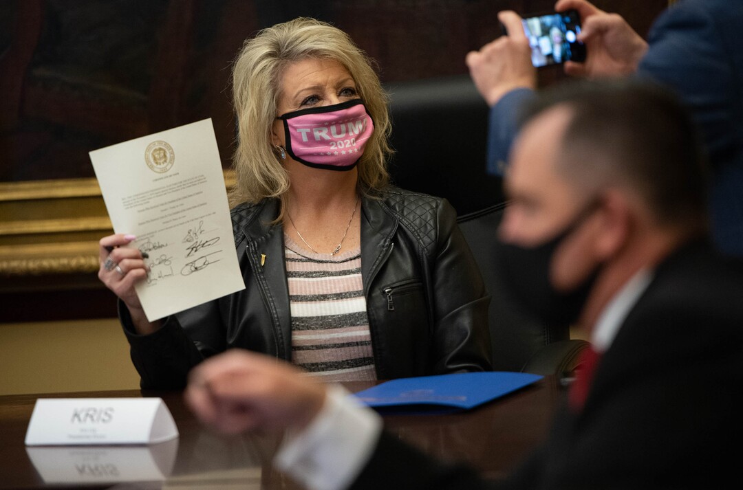(Francisco Kjolseth  | The Salt Lake Tribune) Utah’s six Republican presidential electors, including Kris Udy, former Box Elder County Commission candidate, getting her picture taken, cast their vote for current President Donald Trump at the Utah State Capitol, Monday, Dec. 14, 2020.