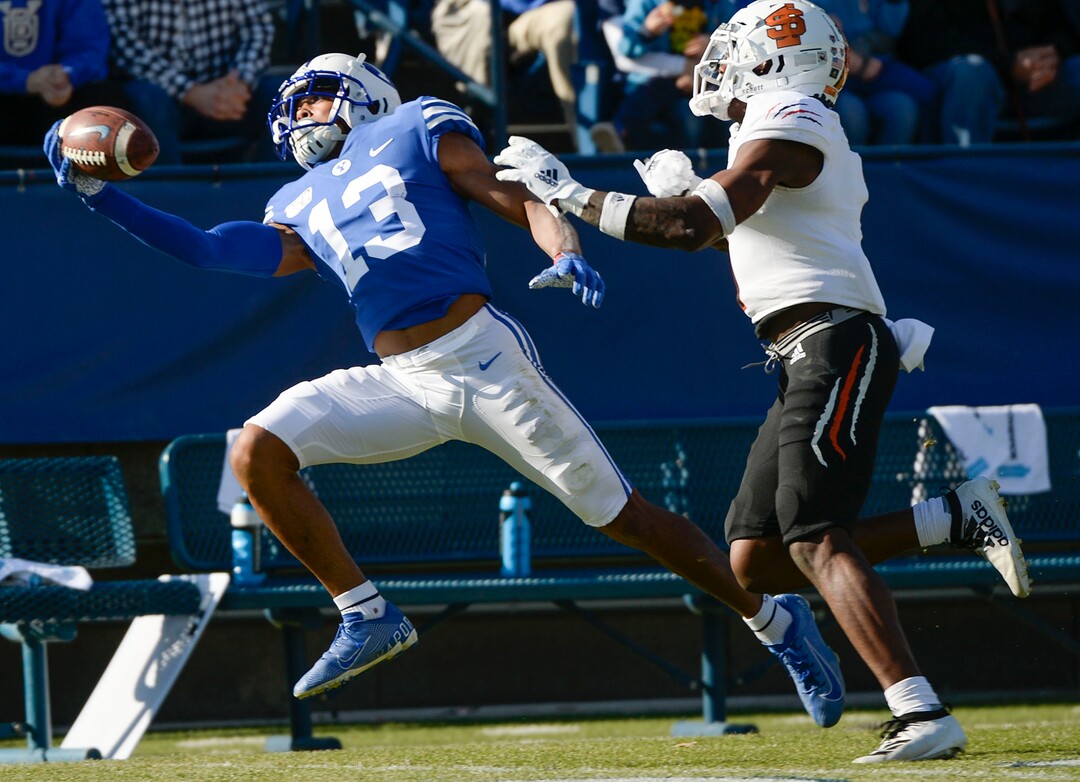 (Leah Hogsten  |  The Salt Lake Tribune) Brigham Young Cougars wide receiver Micah Simon (13) pulls in the pass with one hand as Brigham Young University takes on Idaho State, Saturday, Nov. 16, 2019 at LaVell Edwards Stadium.