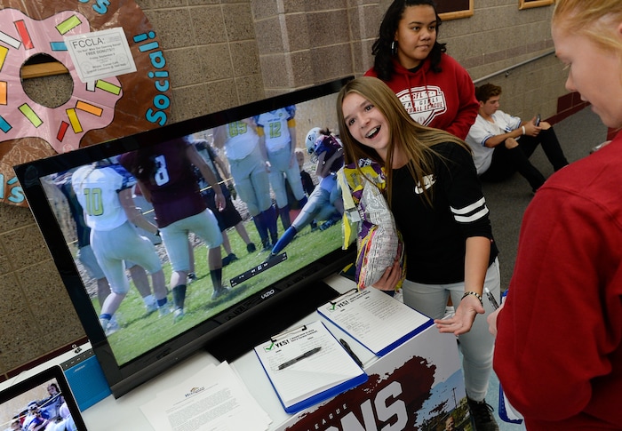 (Francisco Kjolseth | The Salt Lake Tribune) Sam Gordon, 14, works her fellow students at Herriman High School in an effort to sign up girls to play football during a recent clubs sign up day. Brent Gordon and his daughter, Sam, are part of a group suing multiple school districts to try to force the creation of sanctioned girls high school football that would play in the Spring.