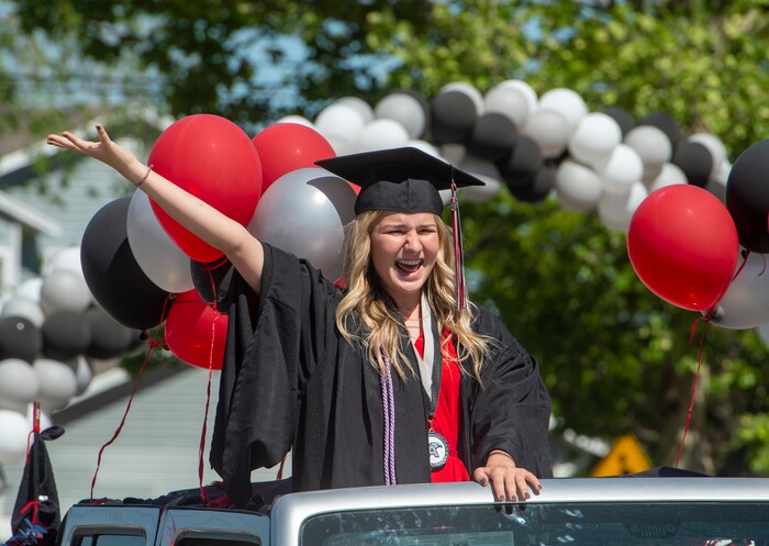 (Rick Egan  |  The Salt Lake Tribune)    Kelsey Gardner waves to teachers as she joins the other Alta High seniors in the parade of 2020 graduates in a “drive through” graduation ceremony at Alta High, Thursday, May 28, 2020.