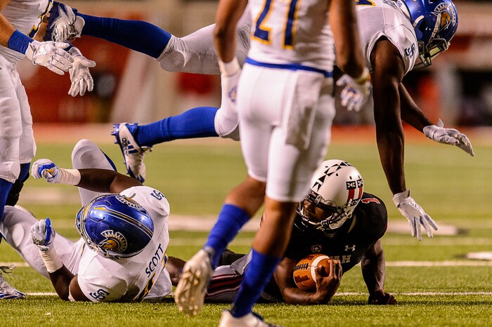 (Trent Nelson | The Salt Lake Tribune) Utah Utes quarterback Tyler Huntley (1) is brought down as the Utah Utes host the San Jose State Spartans, NCAA football at Rice-Eccles Stadium in Salt Lake City, Saturday September 16, 2017.