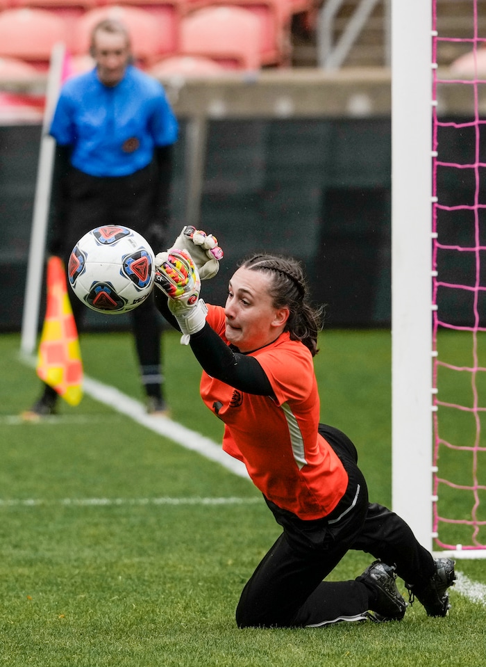 (Leah Hogsten | The Salt Lake Tribune)  Ogden goalie Emily Blackford punches away a penalty kick in the second half. Ogden High School defeated Morgan High School, 1-0, to win the 3A State Soccer Championship game Oct. 23, 2021 at Rio Tinto Stadium.