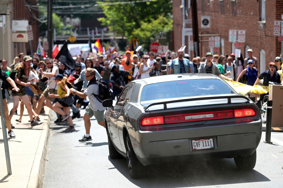 (Ryan M. Kelly  |  The Daily Progress via AP)A vehicle drives into a group of protesters demonstrating against a white nationalist rally in Charlottesville, Va., Saturday, Aug. 12, 2017. The nationalists were holding the rally to protest plans by the city of Charlottesville to remove a statue of Confederate Gen. Robert E. Lee. There were several hundred protesters marching in a long line when the car drove into a group of them.