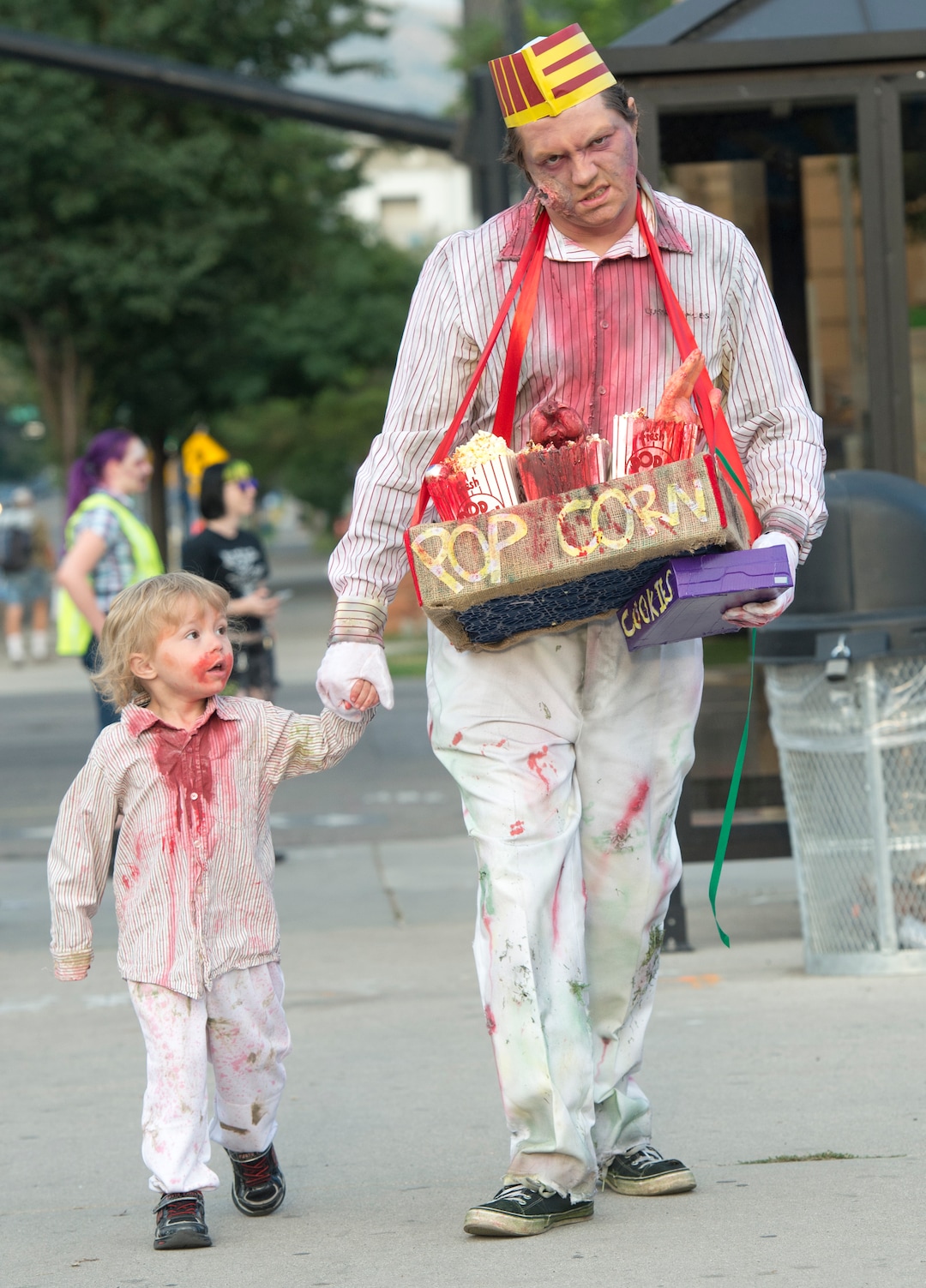  (Rick Egan  |  The Salt Lake Tribune)       Dallas Graham and his son Casper, 3,  walk down 200 South during the 11th annual Salt Lake Zombie Walk, Sunday, Aug. 26, 2018.
