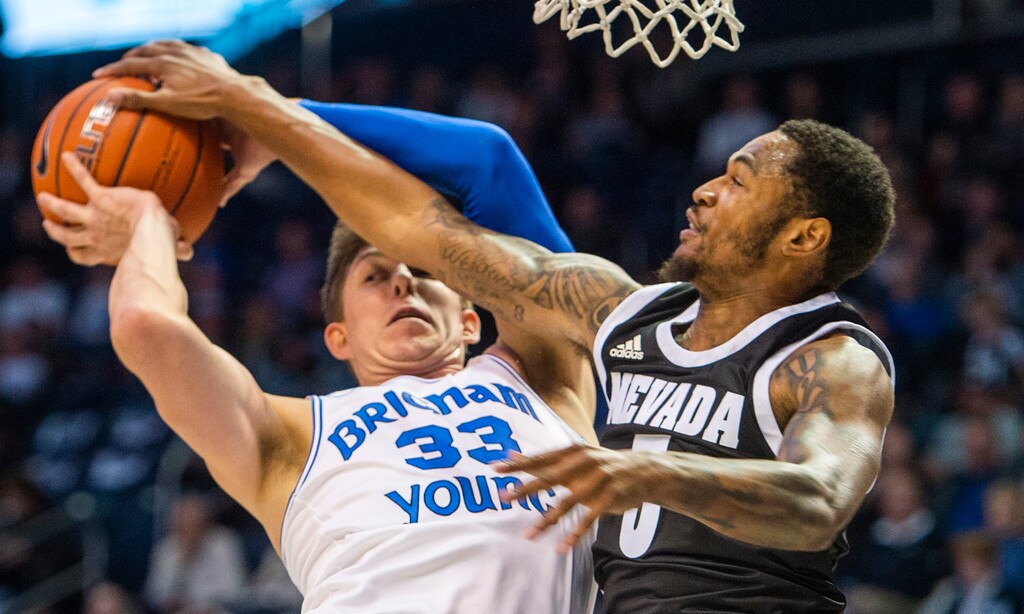 (Rick Egan | The Salt Lake Tribune) Nevada Wolf Pack guard Nisre Zouzoua (5) stops a layup by Brigham Young Cougars forward Dalton Nixon (33) in basketball action at the Marriott Center in Provo, Tuesday, Dec. 10, 2019.