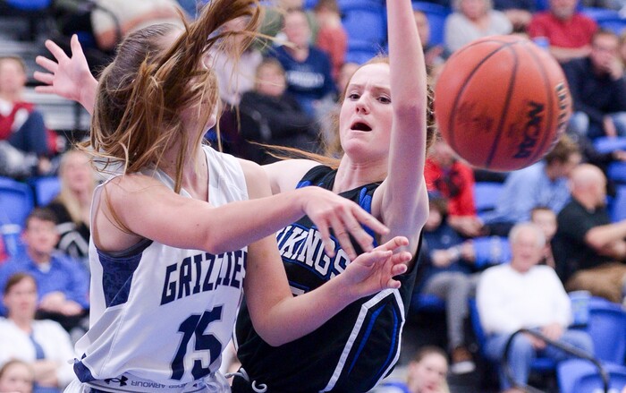 (Leah Hogsten  |  The Salt Lake Tribune)  Pleasant Grove's Andra Hancock pressures Copper Hills' Emily Larsen.   Copper Hills High School girls' basketball team defeated Pleasant Grove High School 66-25 during their Class 6A girls' basketball playoff opener at Salt Lake Community College Tuesday, Feb. 20, 2018. 