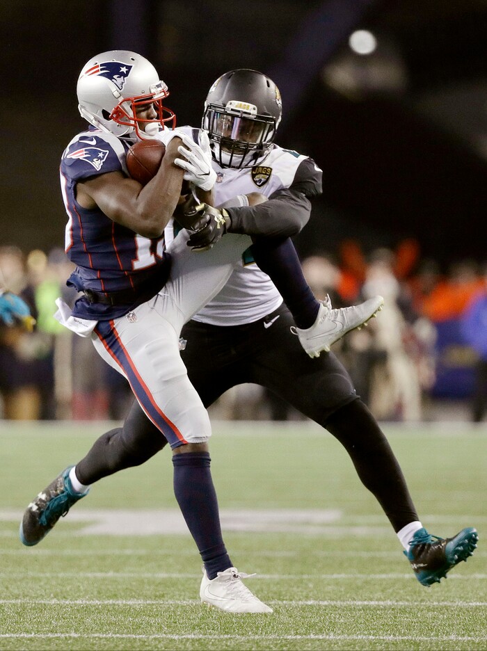 New England Patriots wide receiver Phillip Dorsett (13) makes a catch against Jacksonville Jaguars linebacker Myles Jack (44) during the second half of the AFC championship NFL football game, Sunday, Jan. 21, 2018, in Foxborough, Mass. (AP Photo/David J. Phillip)
