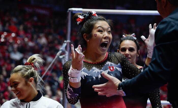 (Francisco Kjolseth  |  The Salt Lake Tribune)  Crystal Isa celebrates with her team following her performance on the bars as Utah hosts Penn State in their season opener at the Huntsman Center in Salt Lake City on Saturday, Jan. 5, 2019.