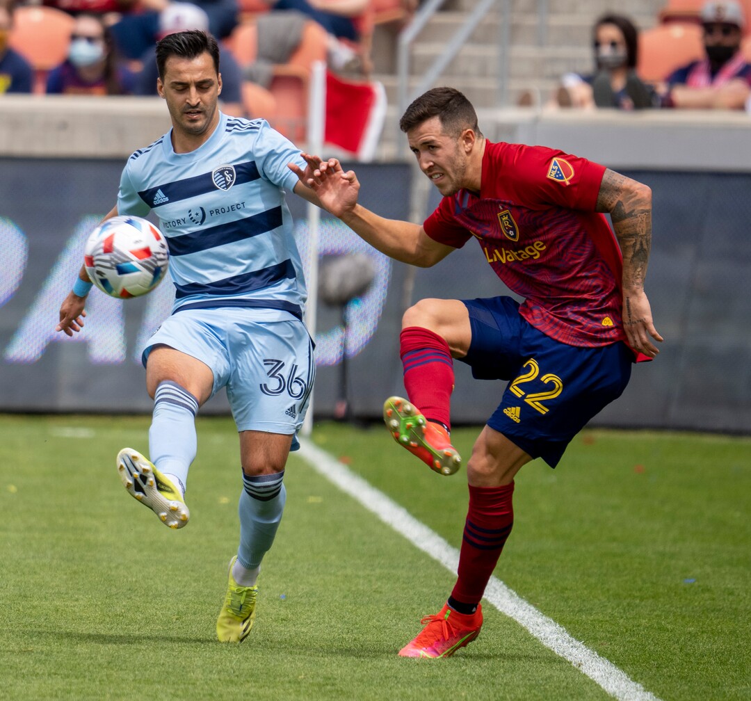 (Rick Egan | The Salt Lake Tribune) Real Salt Lake defender Aaron Herrera (22) kicks the ball as Sporting Kansas City defender Luis Martins (36) defends, in MLS action between Real Salt Lake and Sporting Kansas City at Rio Tinto Stadium, on Saturday, May 1, 2021.